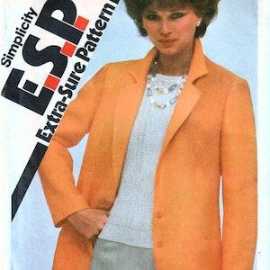 May include: A sewing pattern for a blazer, labeled "Simplicity ESP Extra-Sure Pattern" with the pattern number 9974 and price $1.25. The pattern is for sizes 14, 16, and 18.