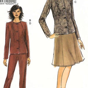 May include: An Easy Vogue sewing pattern envelope featuring illustrations of two outfits. One shows a dark brown jacket and matching trousers. The other shows a textured grey jacket with a tan A-line skirt. The text includes FF, 18-20-22, and Easy Vogue.