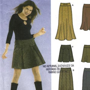 May include: A sewing pattern envelope featuring illustrations of various skirt styles including a long olive green skirt, a shorter dark green pleated skirt, and a brown skirt. The text on the envelope reads NO RETURNS, EXCHANGES OR REFUNDS ON PATTERNS AT FABRIC DEPOT INC.