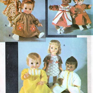 May include: A collection of six dolls wearing different outfits. The dolls are all wearing dresses, with the exception of one doll wearing a white robe. The dolls are all different colors and have different hairstyles.