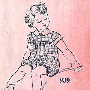 May include: A black and white line drawing illustration of a child with curly hair wearing a short-sleeved, collared, plaid romper with a pocket. The child is sitting down, and the number 939 is printed in black ink on a textured pink background.