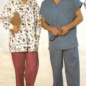 May include: Two people in medical scrubs. One wears a white scrub top with a medical pattern and burgundy trousers. The other wears a blue scrub top and trousers. Both wear white shoes.