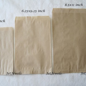 May include: Three brown paper bags of different sizes. The bags are labeled with their dimensions in inches: 5x7 inch, 6.25x9.25 inch, and 8.5x11 inch. The bags are all from JetJewels.