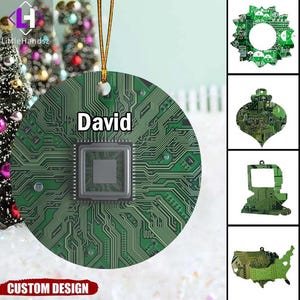May include: A round, green circuit board Christmas ornament with the name "David" printed on it. The ornament has a gold string for hanging. Additional ornaments in the image include a wreath, teardrop, computer, and a map of the USA.