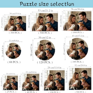 May include: A chart showing different sizes of jigsaw puzzles with corresponding piece counts. The chart shows a couple with two dogs in various puzzle sizes, ranging from 25 to 1000 pieces. The puzzle sizes are shown in both inches and centimetres.