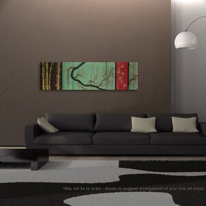 May include: A modern living room interior design with a black sofa and a large abstract painting on the wall. The painting is a multi-panel piece with a green, brown, and red color scheme. The painting features a stylized tree with branches and leaves.