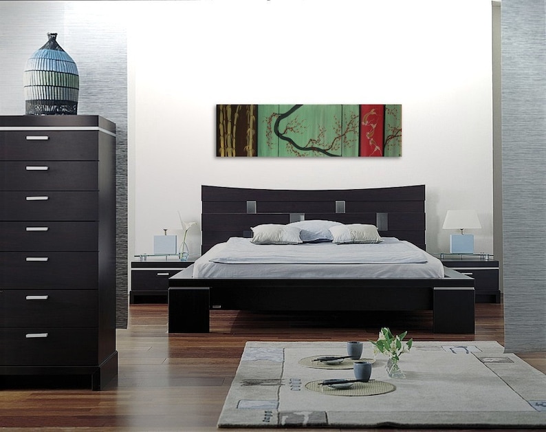 May include: A black platform bed with a curved headboard and a green and red abstract painting above it. The painting features a stylized tree with branches and leaves.