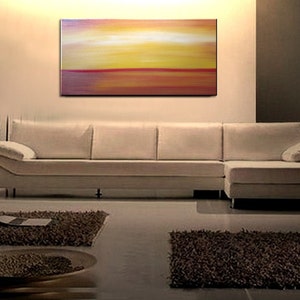 May include: Abstract painting with horizontal stripes of red, orange, yellow, and white. The painting is on a white wall above a white sectional sofa.