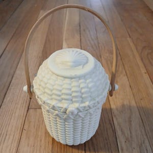 May include: A rustic wooden sign with the text "Welcome to our home" in white lettering. The sign features a distressed finish and a simple, inviting design, perfect for entryway decor.