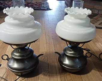 Pretty pair of vintage pewter tone electric table lamps with milk glass shades