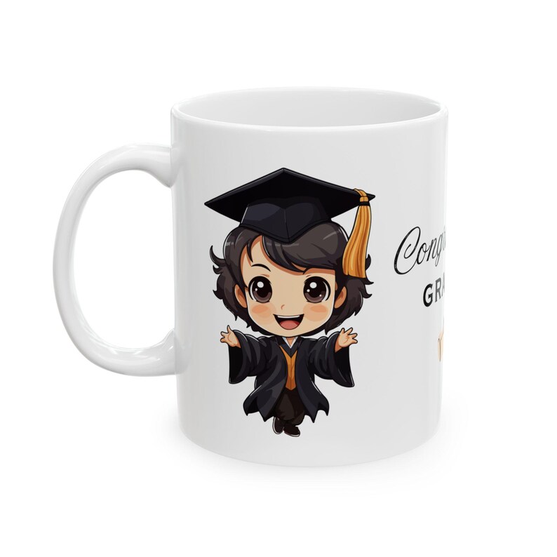 May include: White ceramic mug with a cartoon illustration of a graduate wearing a black cap and gown. The text "Congratulations Graduate" is printed on the mug.