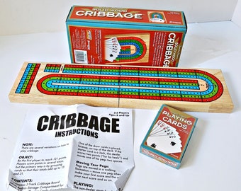 Color Solid Wood Cribbage Game Board with 9 Pegs, 3 tracks, includes playing cards, instructions, 2 to 3 players, folds to take anywhere