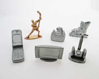 Here and Now Monopoly Game Pieces Metal Pewter Tokens six pieces Segway Transporter, Dog in Handbag, hockey player, skate, cell phone, tv