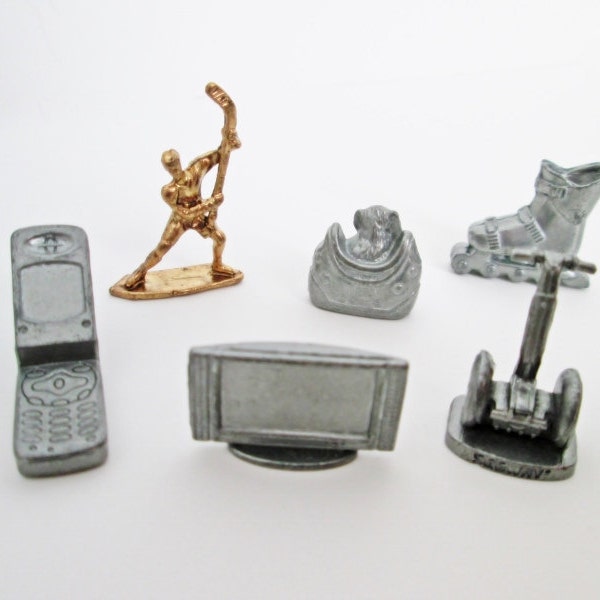 Here and Now Monopoly Game Pieces Metal Pewter Tokens six pieces Segway Transporter, Dog in Handbag, hockey player, skate, cell phone, tv