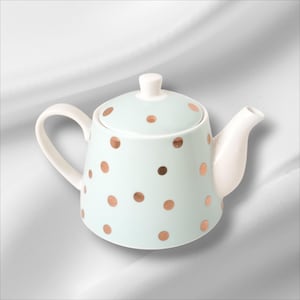 May include: A pale blue ceramic teapot with copper-coloured polka dots. The handle and spout are white. The lid has a small white knob. This teapot is a delightful item for serving tea. The teapot is a charming addition to any kitchen.