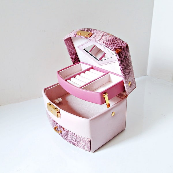 A travel jewelry box, snakeskin box purse, valet tray, faux snake skin top, mirror ring rolls, small pink box purse with drawer