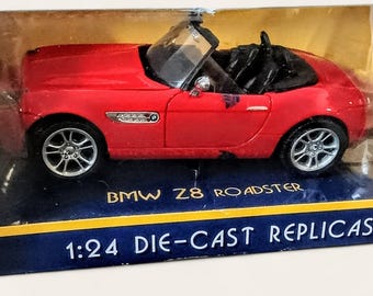 Motor Max 1:24 Scale Die Cast Replica of a Red BMW Z8 Roadster convertible collector car, dresser top, executive desk toy, office decor