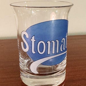 Anuncio de STOMATOL (pasta de dientes) de vidrio raro de la década de 1920