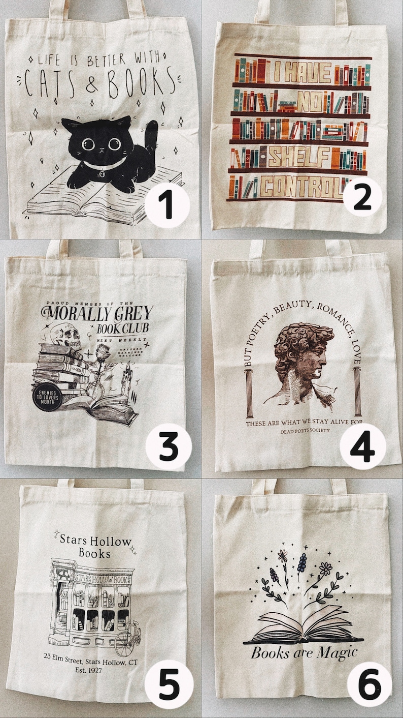 May include: A collection of six canvas tote bags with various book-themed designs. The designs include a black cat with the text "Life is Better with Cats & Books", a bookshelf with the text "I Have No Shelf Control", and a skull with the text "Morally Grey Book Club".