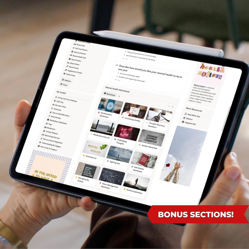 May include: A black tablet displaying a digital wellness planner with various mental health worksheets. The screen shows sections for self-care, mood tracking, and more. A stylus rests on top. The text "IN THE MOOD TO HAVE A" and "BONUS SECTIONS!" are visible.