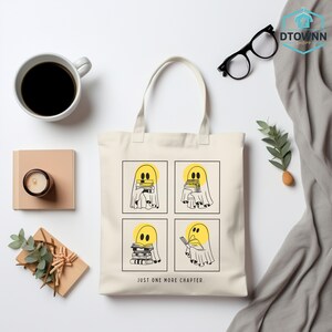 a tote bag sitting on top of a table next to a cup of coffee