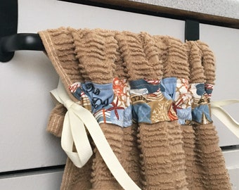 By the Sea Patch. Brown Cotton Kitchen towel. Ties on with ribbon. Attaches to handle.  Beach theme