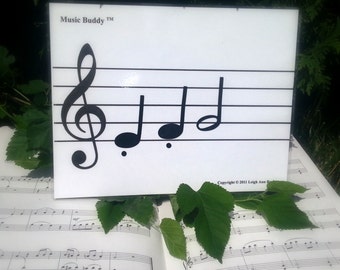 Music Buddy is a hands-on musical note teaching aid.  Makes reading music FUN!