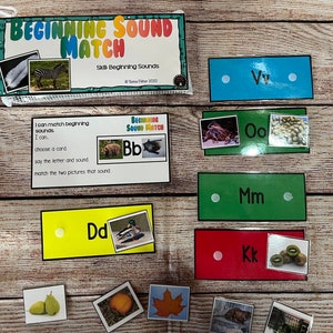 May include: A set of colorful cards with pictures and letters for learning beginning sounds. The cards are labeled with the letters "Bb", "Dd", "Kk", "Mm", "Oo", and "Vv".