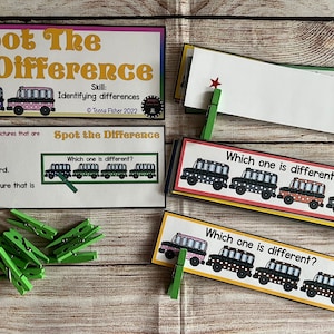 May include: A set of printable cards for a "Spot the Difference" game. The cards feature a row of cartoon school buses with small differences between each bus. The cards are designed to help children develop visual discrimination skills. The text on the cards reads "Spot the Difference" and "Which one is different?"