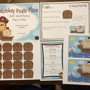 May include: Educational place value game titled "Lil' Monkey Pirate Place." The game features pirate-themed illustrations of treasure chests and ships, with numbers and place value labels. Includes an answer key and instructions for identifying place value through the thousands.