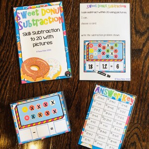 May include: A set of educational cards for teaching subtraction with pictures. The cards feature colorful donuts and a dry erase marker. The cards are labeled "Sweet Donut Subtraction" and "Skill: Subtraction to 20 with pictures".