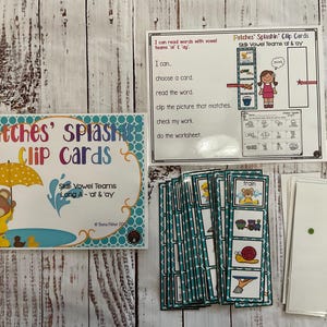 May include: A set of colorful educational clip cards featuring a cartoon bear wearing a raincoat and holding an umbrella. The cards are designed to help children learn about vowel teams and long A sounds. The text on the cards reads "Patches' Splashin' Clip Cards" and "Skill Vowel Teams Long A - 'at' & 'ay'".