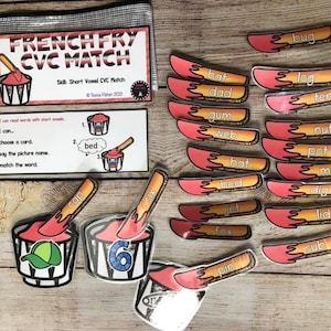 May include: A set of French Fry CVC Match educational game pieces. The game includes red and yellow french fry shaped cards with short vowel CVC words like "bug", "bat", "dad", "log", "ten", "gum", "web", "nut", "pot", "hat", "bed", "mop", "dig", "jet", "lid", "fox", "sub", and "pin". There are also four red and white striped cups with different pictures inside.