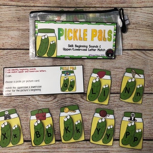 May include: A set of 10 printable cards featuring pickle jars with uppercase and lowercase letters. The cards are designed for a beginning sounds and letter matching activity. The text on the cards reads "Pickle Pals" and "Skill: Beginning Sounds & Upper/Lowercase Letter Match".