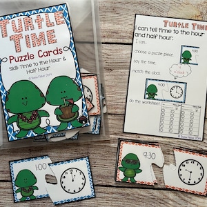 May include: A set of "Turtle Time" puzzle cards in a clear plastic bag. The cards teach time-telling skills. The package includes puzzle pieces with clock faces and times like 1:00 and 9:30, and a worksheet. The text on the package reads "Puzzle Cards Skill: Time to the Hour & Half Hour."