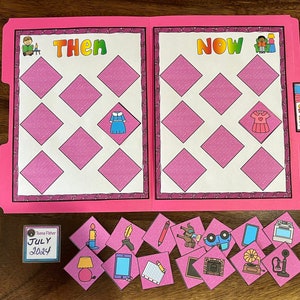 May include: A pink folder game with the words "Then" and "Now" on the front. The folder has nine pink diamond-shaped spaces on each side. There are 14 small pink squares with various images on them, including a candle, a pen, a pencil, a book, a phone, a lamp, a fireplace, a gramophone, and a telephone.