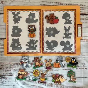 May include: A set of 12 colorful animal and nature themed felt pieces with matching shadow outlines. The pieces include a squirrel, owl, deer, raccoon, hedgehog, wolf, mouse, bear, and more. The pieces are designed for a matching game or activity.