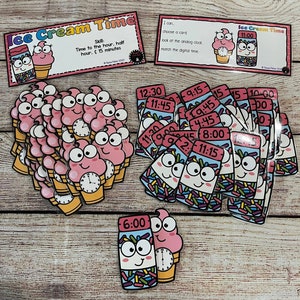May include: A set of colorful ice cream cone and ice cream jar cards with analog clocks and digital times. The cards are designed for a time-telling game. The cards feature the text "Ice Cream Time" and "Skill: Time to the hour, half hour. (15 minutes)".