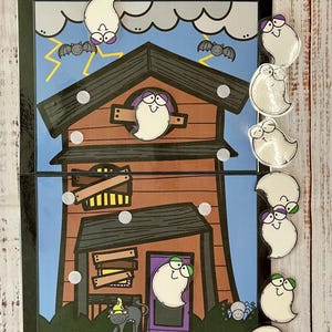 May include: A haunted house game with a brown wooden house with a purple door and a black cat with a yellow hat. There are 7 white ghosts with different colored eyes and mouths. The game is called "Haunted House" and is from "Effortless Learning".