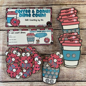 May include: Educational game featuring coffee cup and donut graphics for counting dimes. The game includes cards with text "Coffee & Donut Dime Count" and "I can count dimes." The donuts have dollar amounts. The skill is counting by 10s.