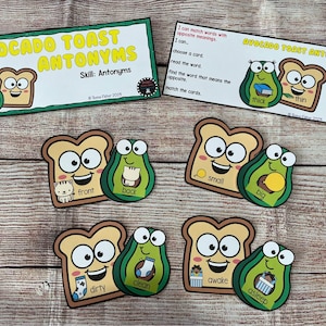 May include: Educational game featuring avocado and toast characters. The game includes cards with antonyms like "thick" and "thin", "small" and "big", and "dirty" and "clean". The text "AVOCADO TOAST ANTONYMS" is displayed on the cards.