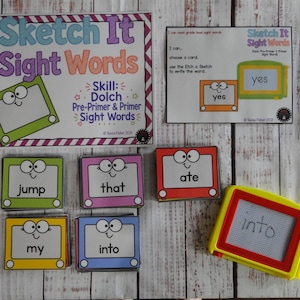 May include: An educational activity set featuring a large instructional sign titled Sketch It Sight Words, a smaller instruction card, and multiple rectangular cards with cartoon drawing boards displaying words like jump, that, ate, my, and into. A yellow and red drawing toy is included.