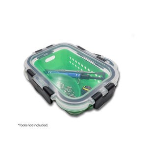 May include: A clear plastic container with a green silicone insert and a black latch. The container has a mesh design and is open to reveal the inside. "Tools not included." is written below the container.