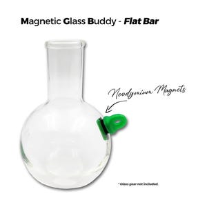 May include: A clear glass beaker with a green neodymium magnet attached to the side. The magnet is labeled "Neodymium Magnets".