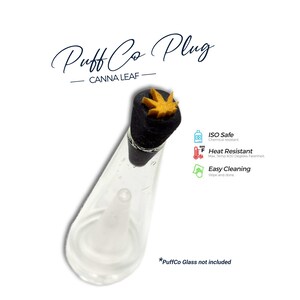 May include: A black plug accessory for a glass device, featuring a yellow cannabis leaf topper. Text reads Puff Co Plug, Canna Leaf, ISO Safe, Heat Resistant Max Temp 600 Degrees Fahrenheit, and Easy Cleaning. Note: PuffCo Glass not included.