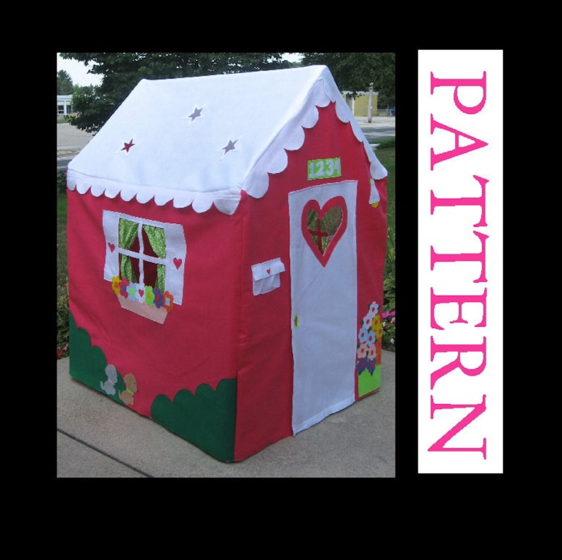 May include: A red and white playhouse tent with a heart-shaped door, a window with a flower box, and a white roof with stars. The tent has a green grass border and a white door with the number 123 on it.