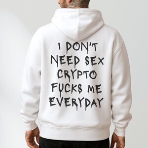 May include: A white ceramic mug with a black handle and the text "But First, Coffee" in a black, bold font. The mug is sitting on a wooden surface. The mug is approximately 4 inches tall.