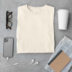 May include: A set of three ceramic mugs with a speckled, matte finish. The mugs are in shades of cream, light gray, and dark gray. Each mug has a simple, minimalist design, perfect for coffee or tea.