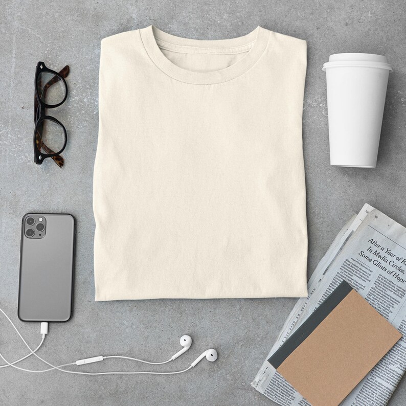 May include: A set of three ceramic mugs with a speckled, matte finish. The mugs are in shades of cream, light gray, and dark gray. Each mug has a simple, minimalist design, perfect for coffee or tea.