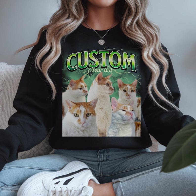 May include: A black crewneck sweatshirt featuring a graphic print of five orange and white cats against a green lightning background. The text CUSTOM is printed in large green letters at the top, with the words Your text printed below it.